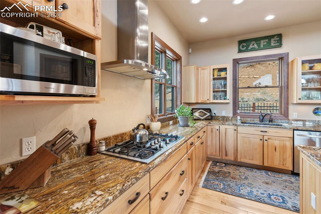 Image 19 of 47: Kitchen island with vegetable sink.