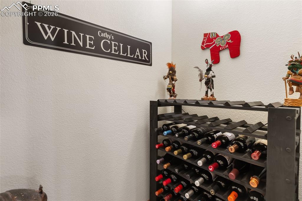 Image 32 of 47: Family room and wine cellar lower level
