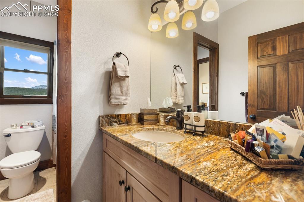 Image 40 of 48: Family room and wine cellar lower level