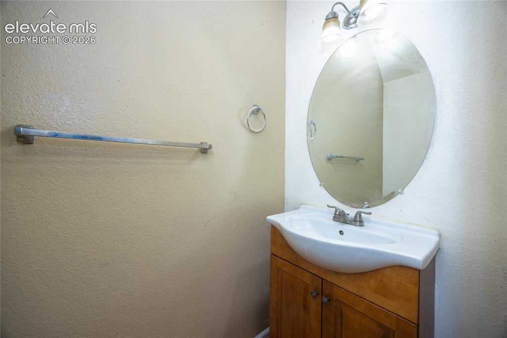 Image 12 of 26: Half bathroom on main floor