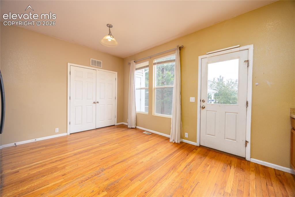 Image 13 of 26: Back door from kitchen and laundry area