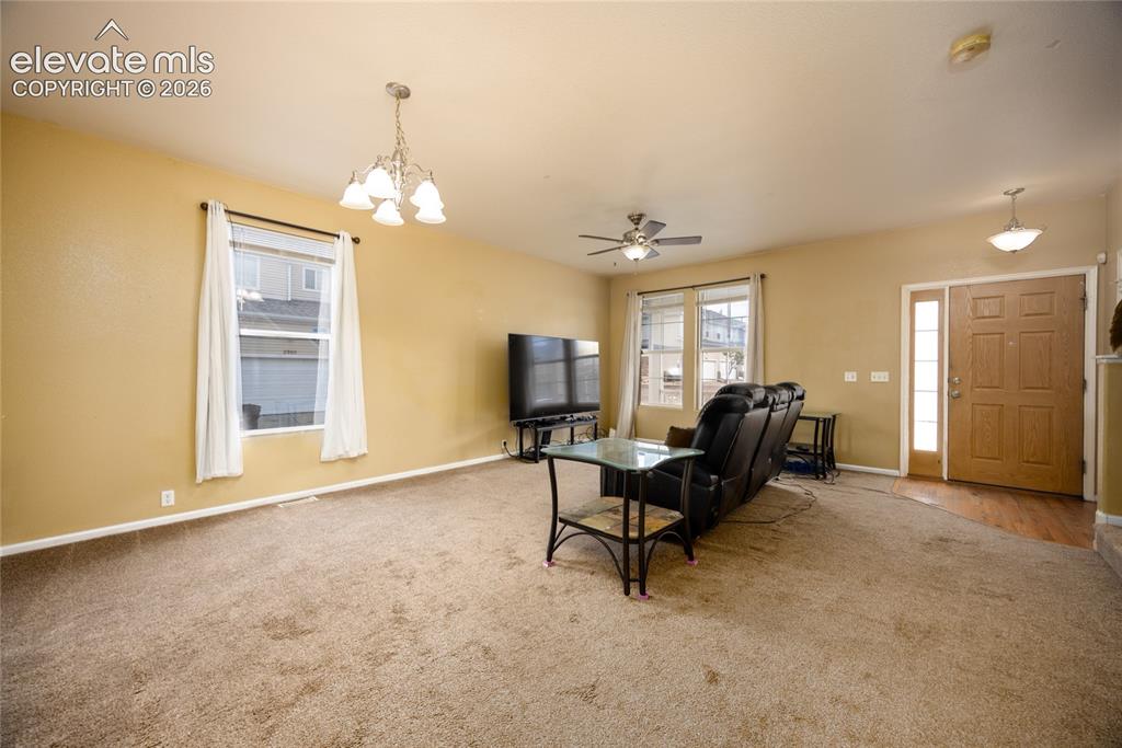 Image 5 of 26: Living room, dining room, front door