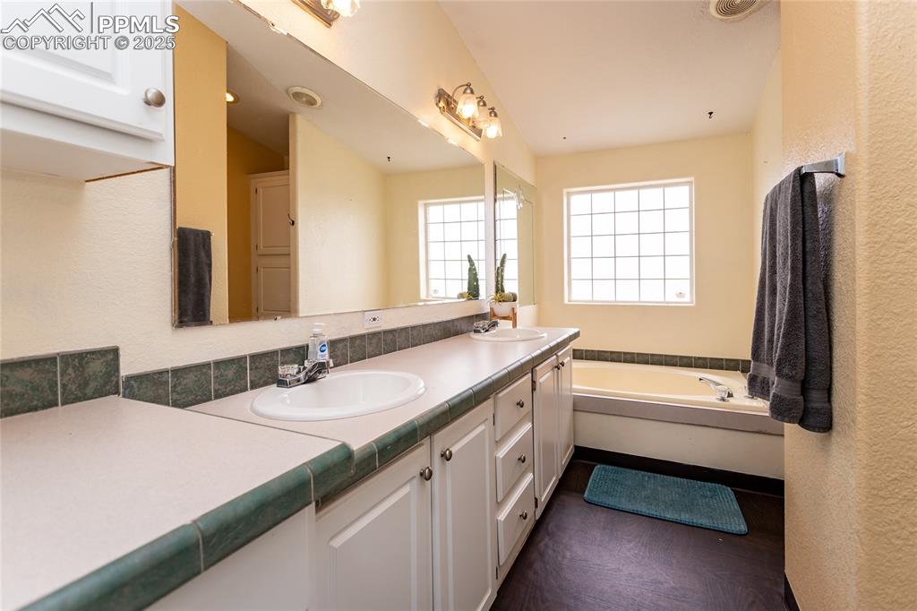 Image 12 of 50: Master Bathroom
