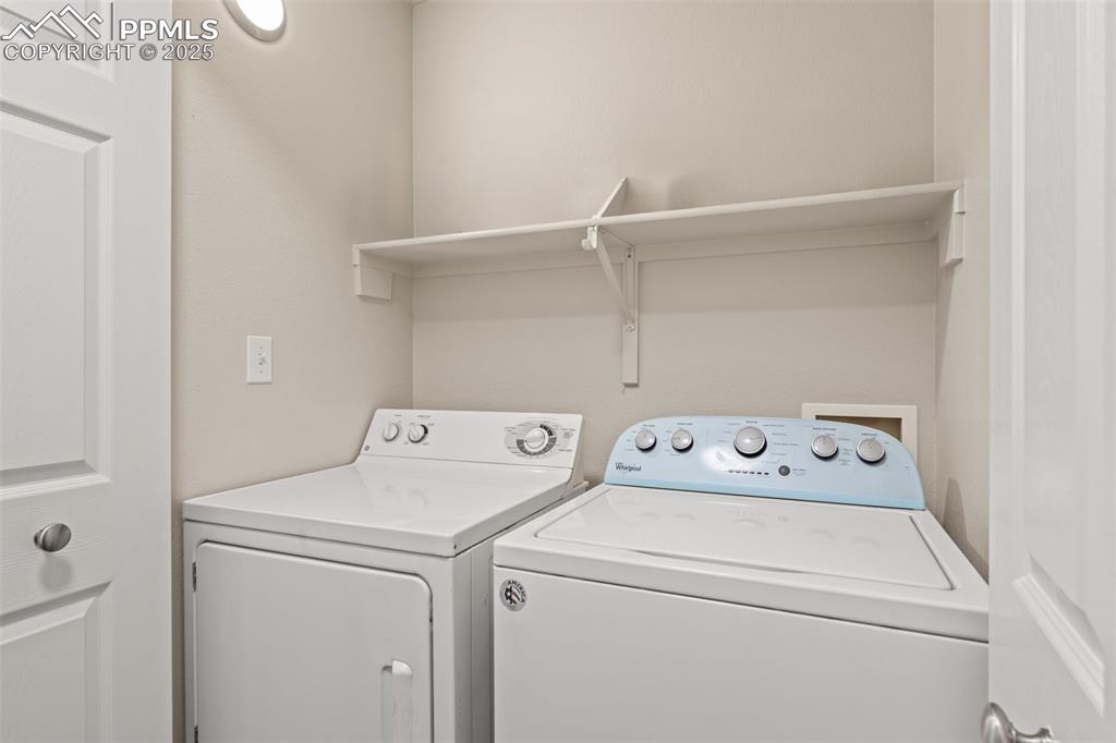 Image 31 of 42: Washer/Dryer included, shelves for easy storage