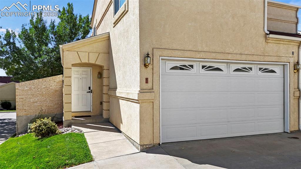 Image 33 of 42: 2-car garage with remote control