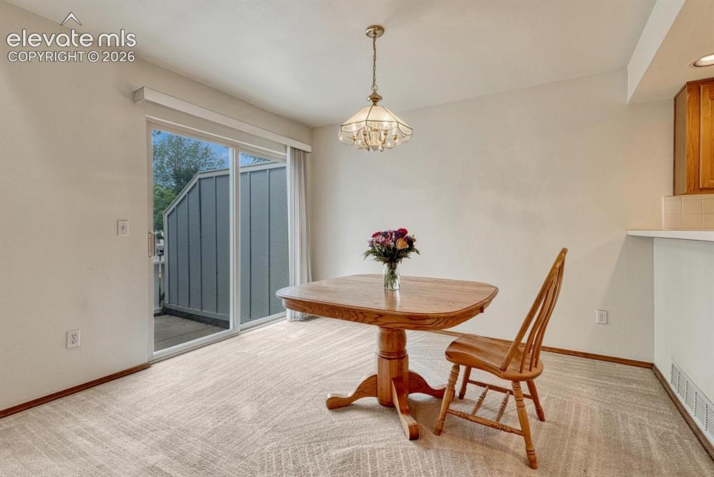 Image 14 of 50: Dining room walks out to front patio