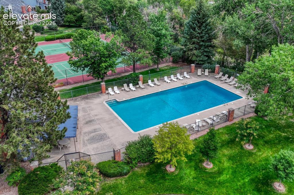 Image 5 of 50: Community center, pool, and tennis courts are provided to residents through