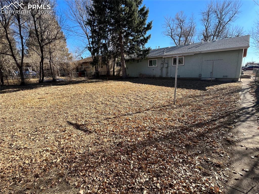 Image 7 of 15: Backyard looking towards house