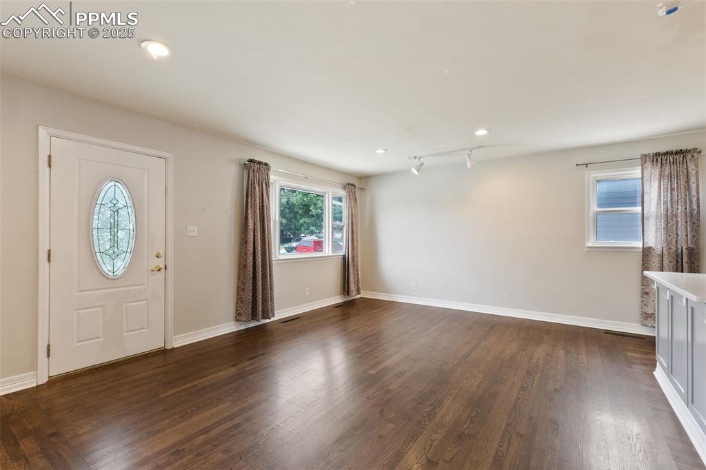 Image 10 of 36: Foyer featuring healthy amount of natural light, dark wood-type flooring, a