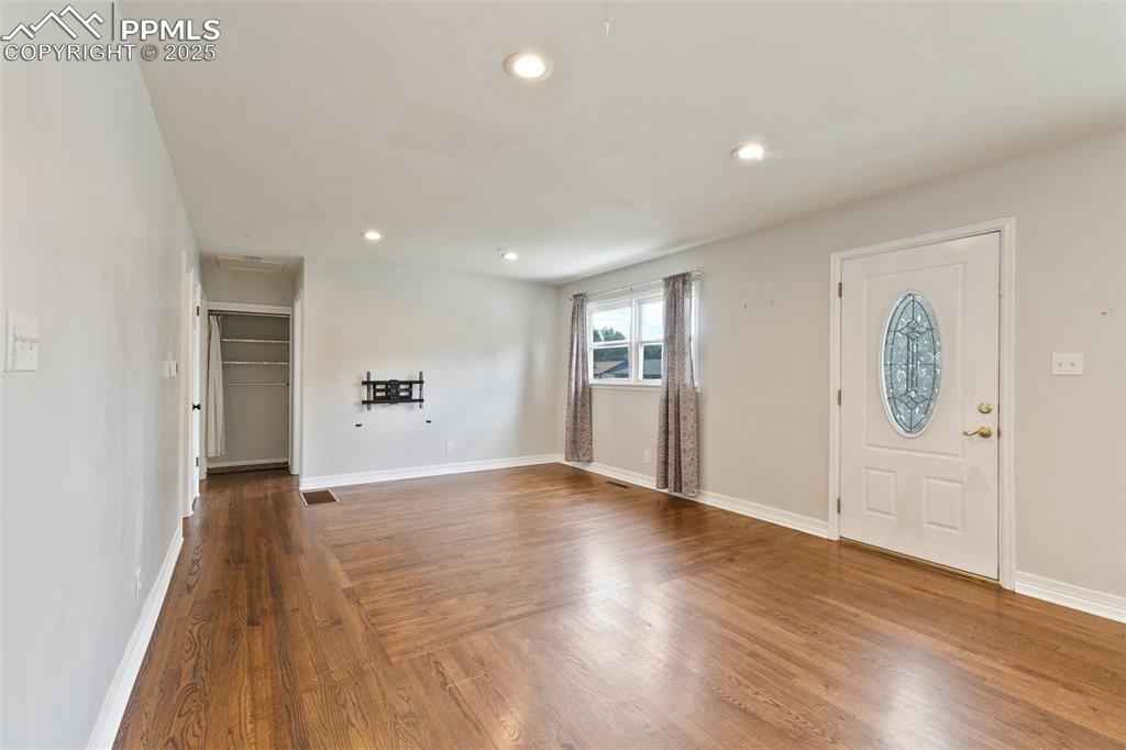 Image 14 of 36: Foyer with recessed lighting and wood finished floors