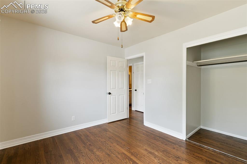 Image 19 of 36: Unfurnished bedroom featuring dark wood-type flooring, a closet, and a ceil
