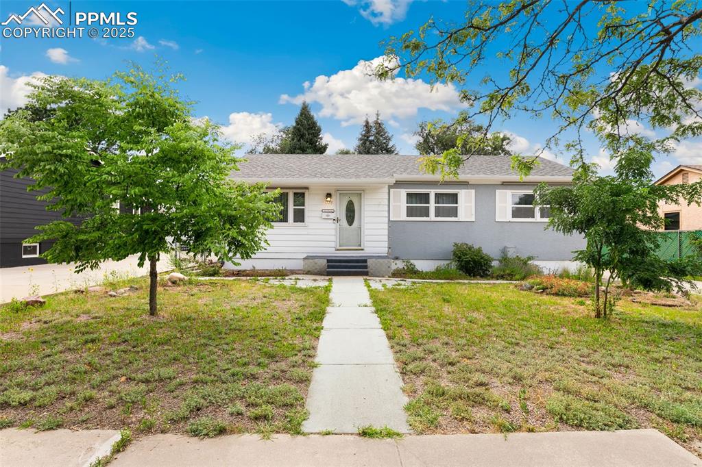 Image 2 of 36: Ranch-style house featuring a front yard and a shingled roof