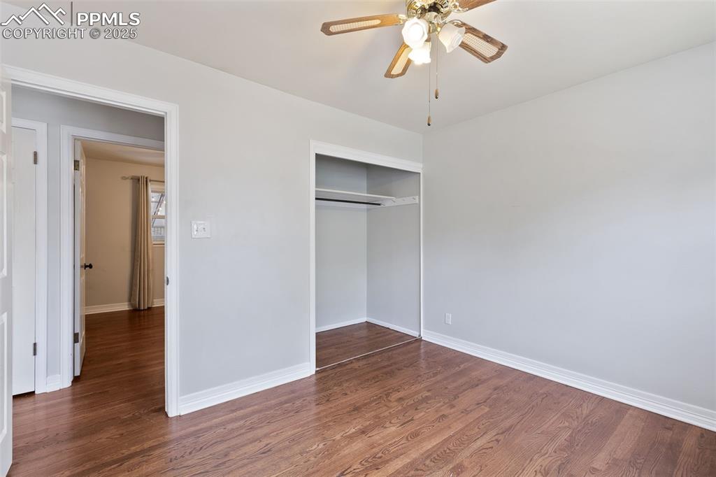 Image 20 of 36: Unfurnished bedroom featuring wood finished floors, a closet, and ceiling f