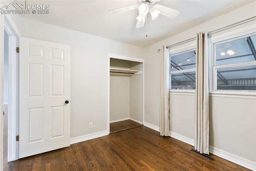 Image 23 of 36: Unfurnished bedroom featuring dark wood-type flooring, a closet, and a ceil