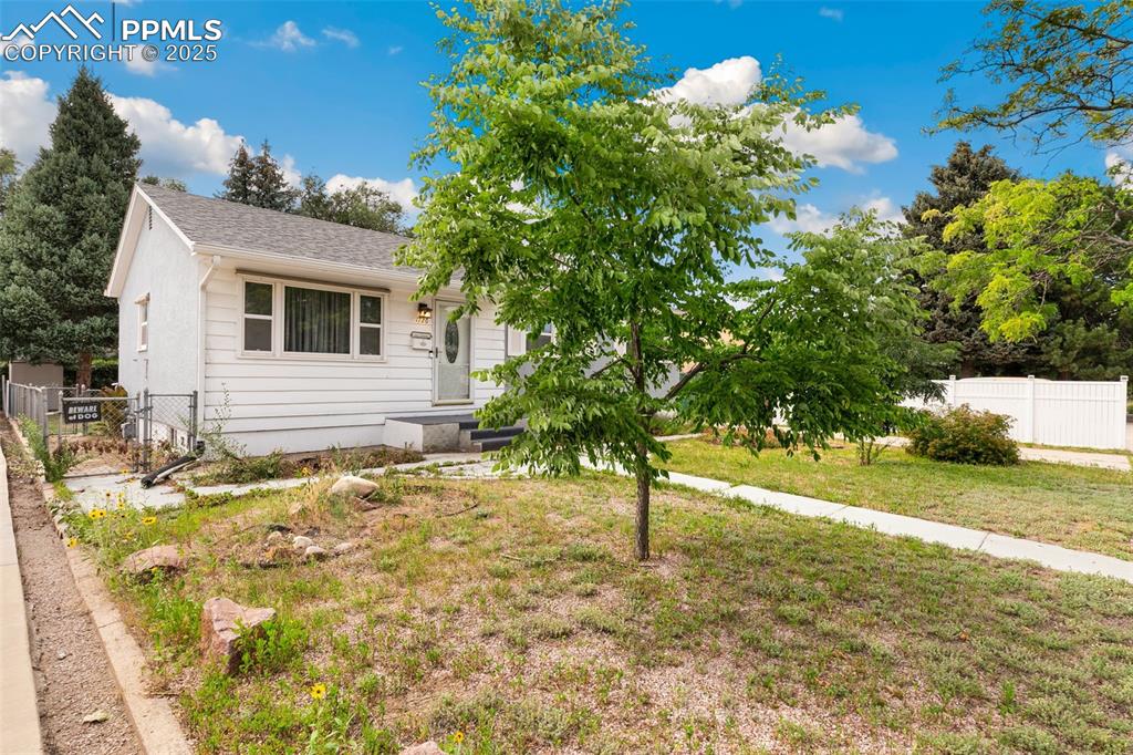 Image 3 of 36: View of front facade with a shingled roof