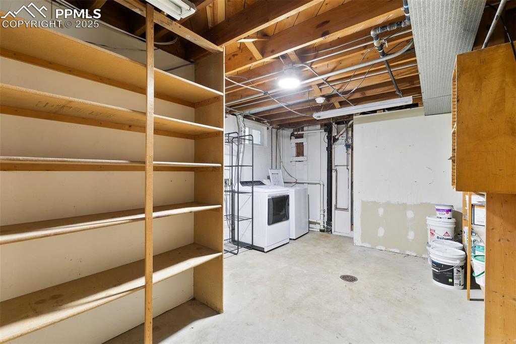 Image 34 of 36: Unfinished basement with independent washer and dryer