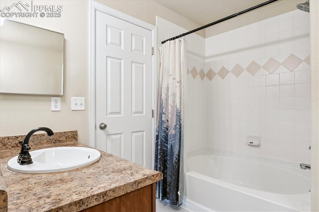 Image 12 of 29: Full bathroom with two vanities