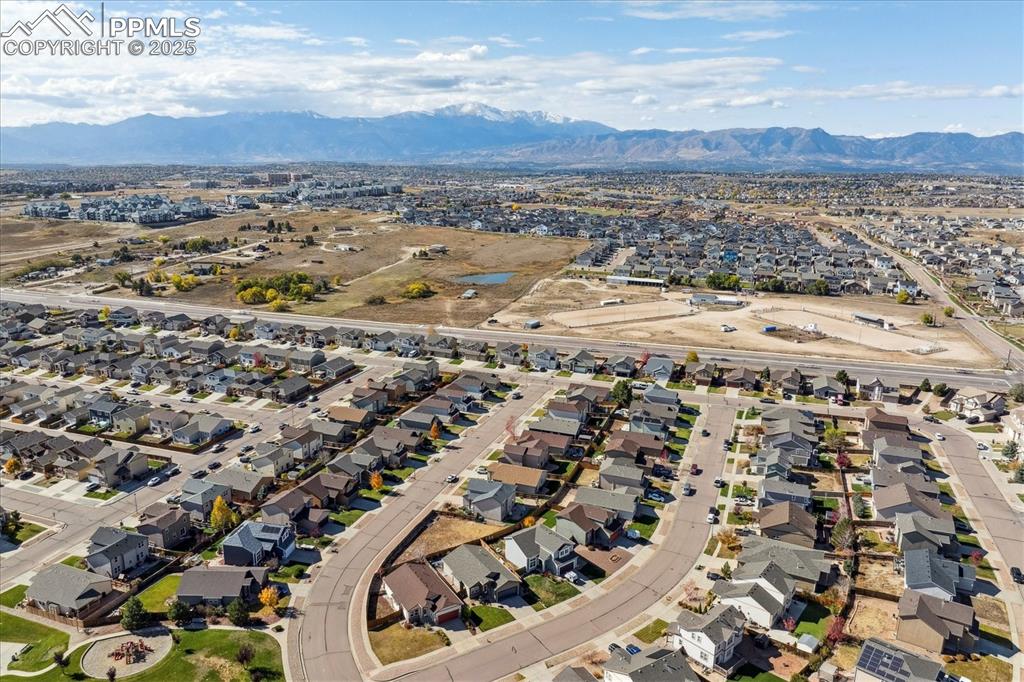 Image 26 of 29: Aerial view of property and surrounding area featuring nearby suburban area