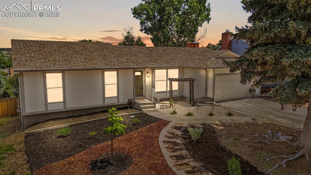 Caption: Twilight Photo of Exterior of Home