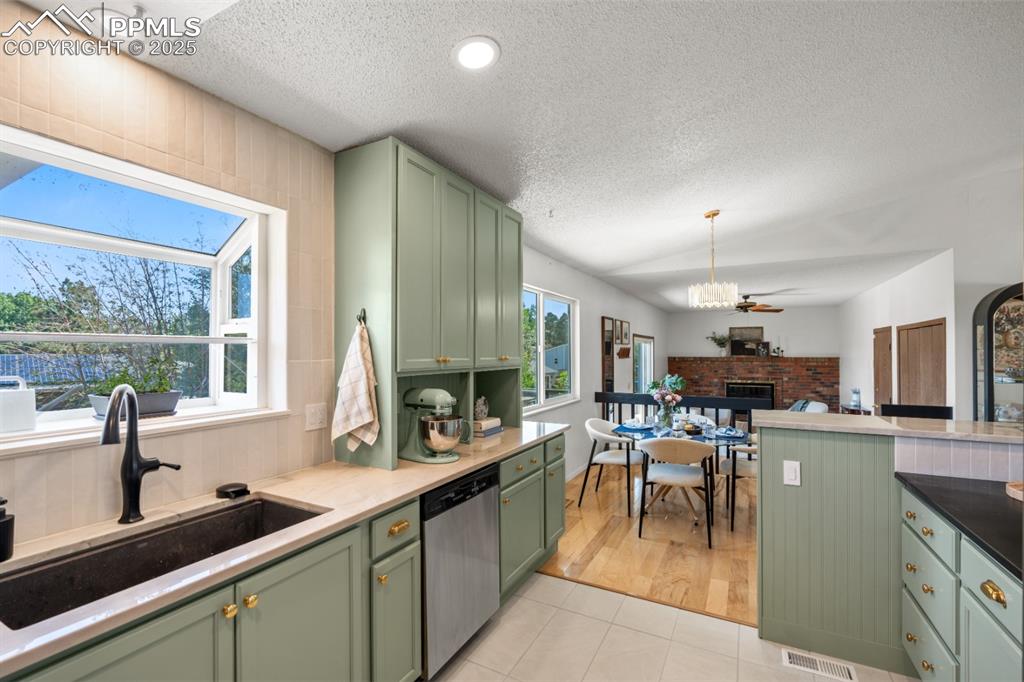 Image 13 of 46: Renovated Kitchen with custom cabinets, quartz countertops, upgraded applia