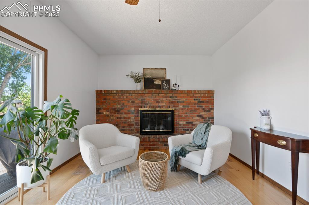 Image 14 of 46: Secondary Living Space with Gas Fireplace (with wood option)