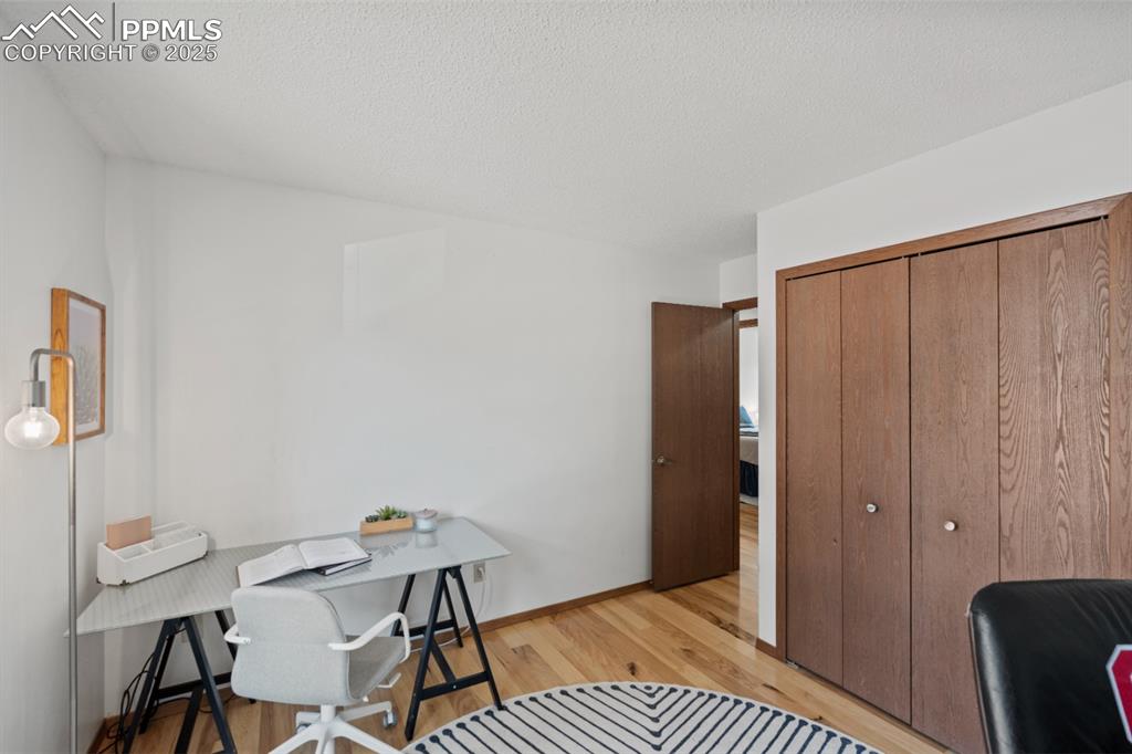 Image 31 of 46: Secondary Bedroom on Main Floor (currently converted office space)
