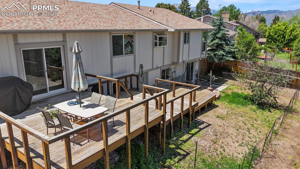 Image 40 of 46: Rear of House, Three-Tiered Deck that can support a hottub. 