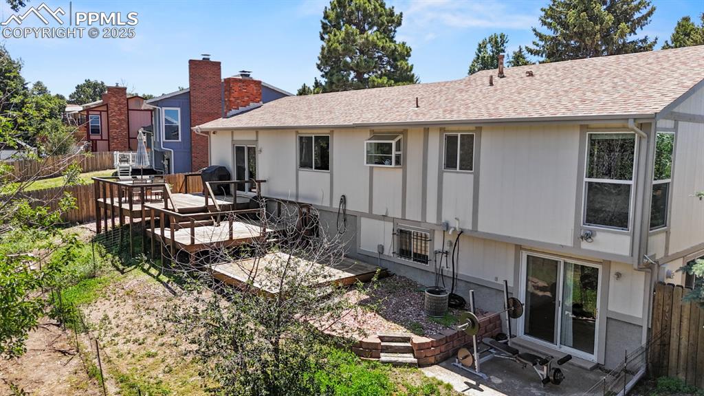 Image 41 of 46: Rear of House, Three-Tiered Deck that can support a hottub.