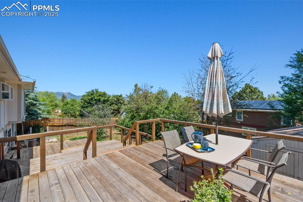 Image 42 of 46: Rear of House, Three-Tiered Deck that can support a hottub.
