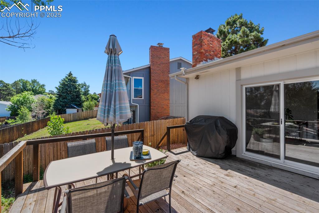 Image 43 of 46: Rear of House, Three-Tiered Deck that can support a hottub.
