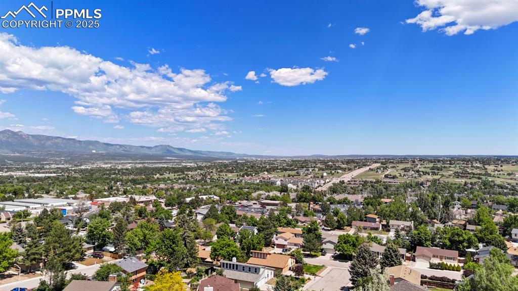 Image 46 of 46: Aerial perspective of suburban area with mountains