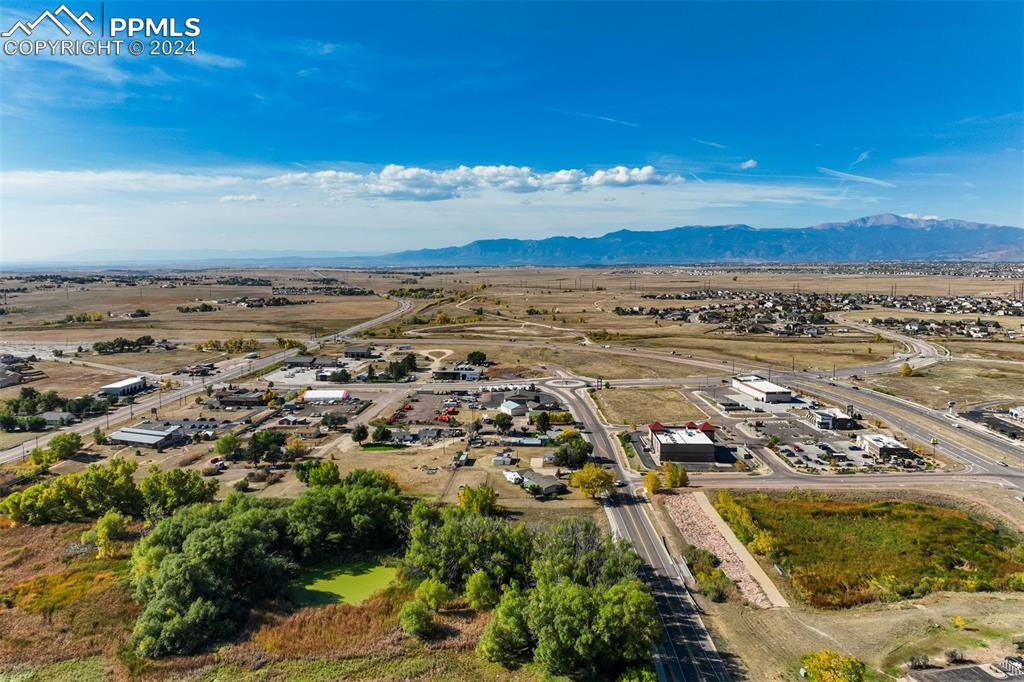 Image 12 of 13: Birds eye view of property featuring a mountain view