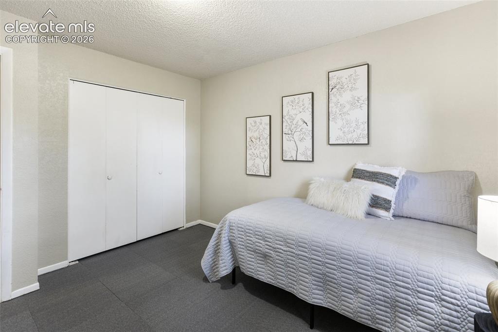 Image 20 of 41: Neutral tone walls featuring textured accent wall