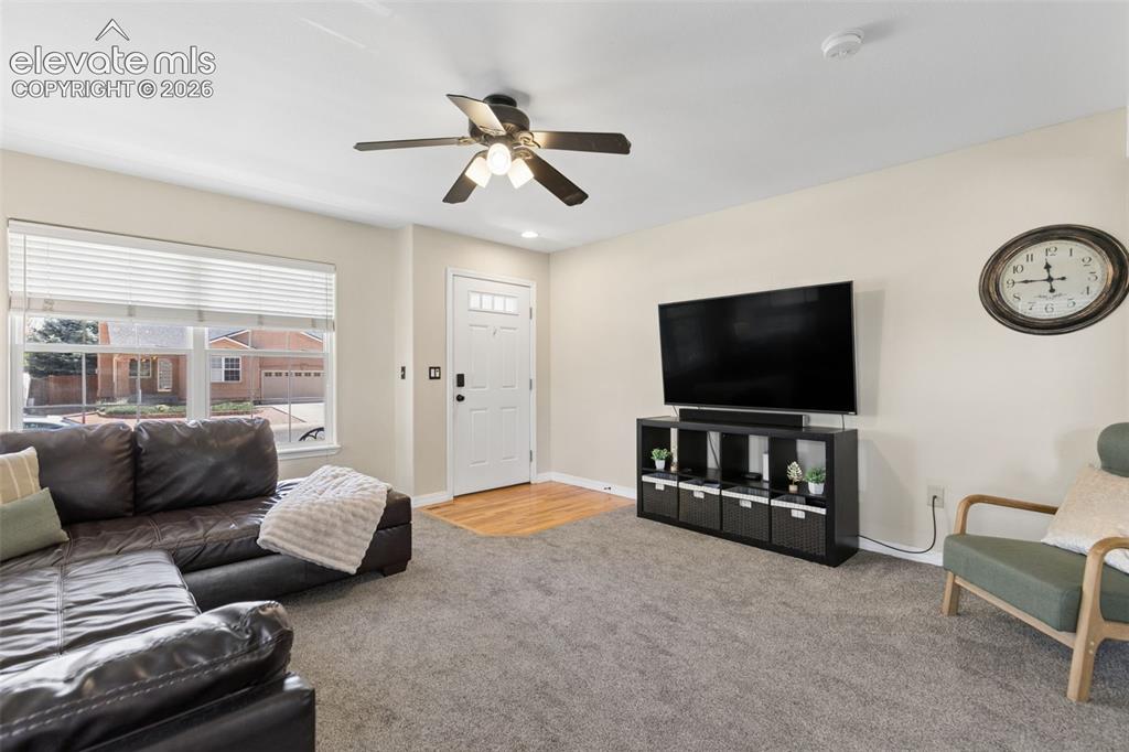 Image 14 of 48: Recessed lighting, ceiling fan, and light-toned wall finishes