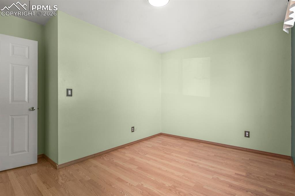 Image 16 of 49: Unfurnished room with light wood-style flooring