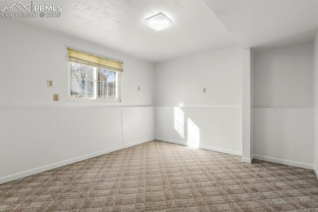 Image 28 of 49: Extra room that can be used as flex space , office , hobby or a gym