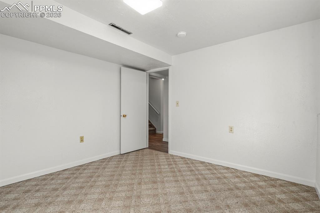 Image 30 of 49: Extra room that can be used as flex space , office , hobby or a gym 