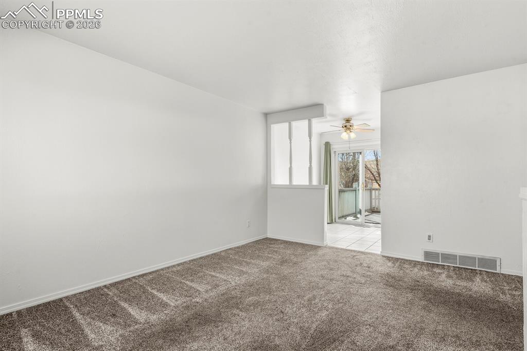Image 6 of 49: Unfurnished room featuring carpet flooring and a ceiling fan