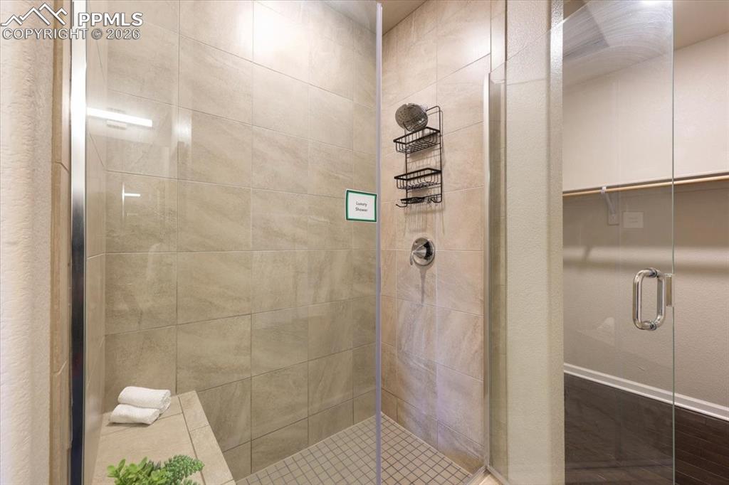Image 12 of 19: Full bathroom featuring a stall shower