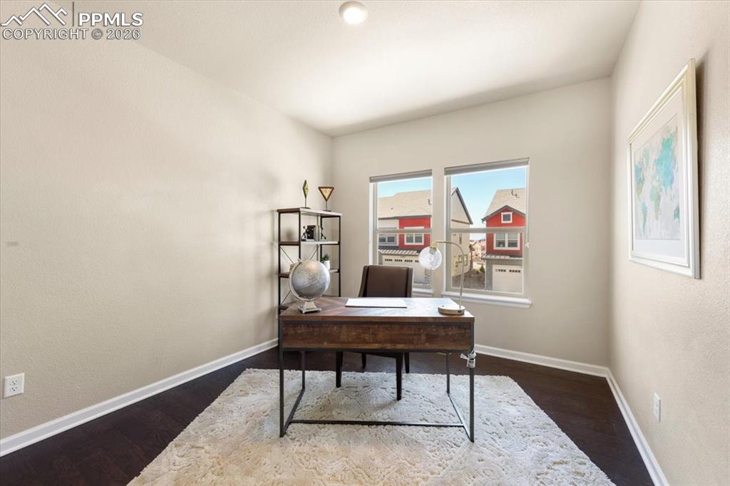 Image 17 of 19: Office featuring baseboards and wood finished floors