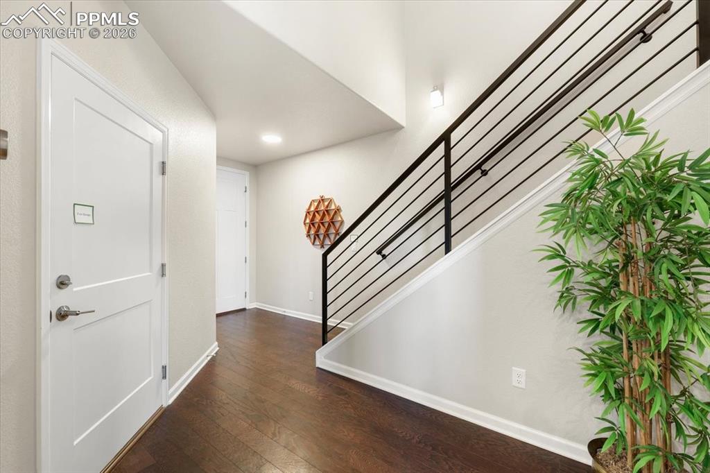 Image 7 of 19: Entrance foyer featuring dark wood-type flooring, recessed lighting, basebo