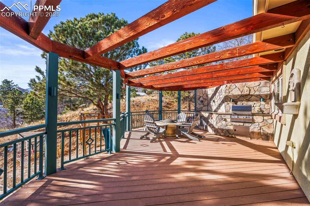 Image 20 of 50: Outdoor kitchen and fire pit