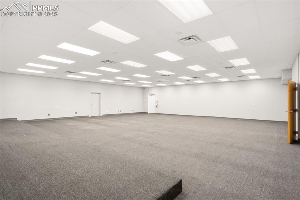 Image 23 of 26: Unfurnished room featuring carpet flooring