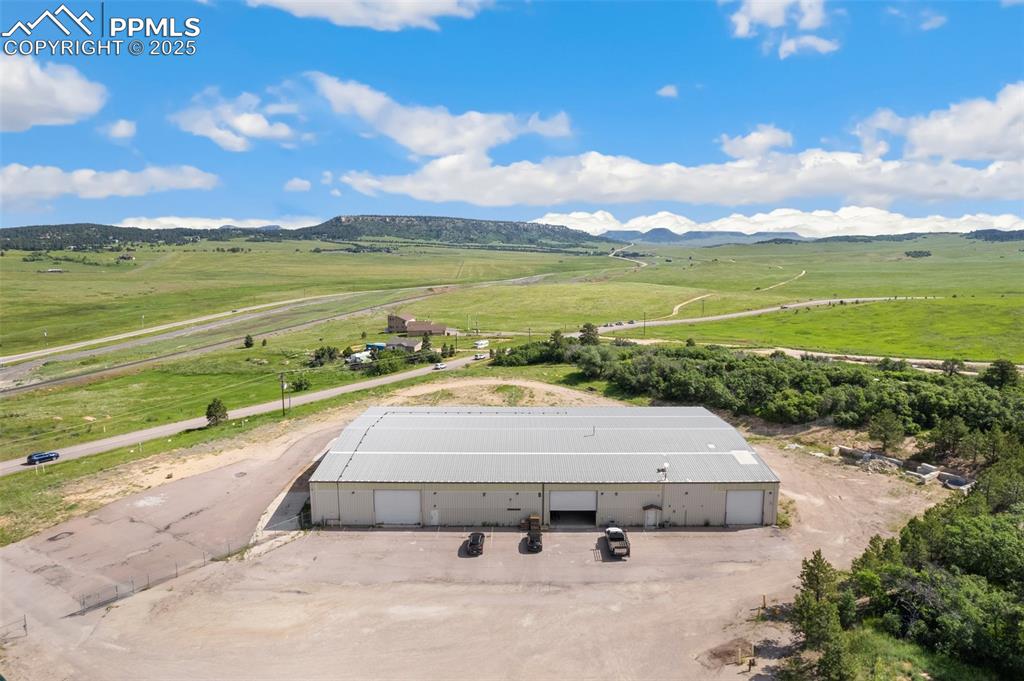 Image 5 of 26: Overview of rural landscape featuring a mountainous background