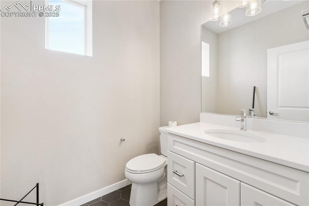 Image 11 of 42: Main level half bath