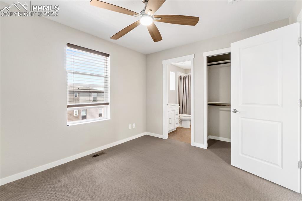 Image 34 of 42: Upper bedroom with attached bathroom and large closet