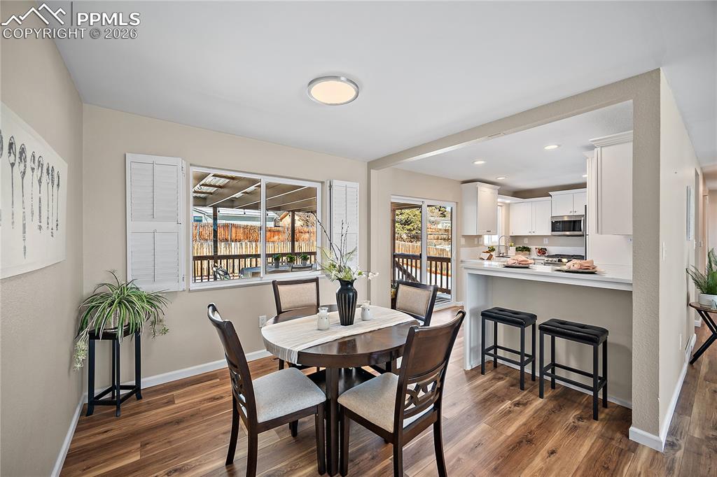 Image 10 of 45: Large picture window,  breakfast bar, walk out kitchen.