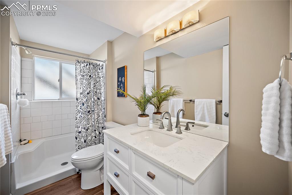 Image 31 of 45: Lower level 3/4 bath. New vanity, flooring, paint and lighting. 