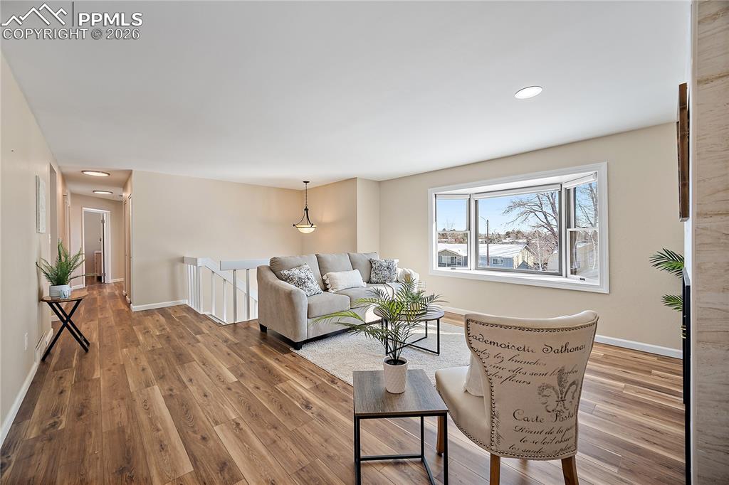 Image 4 of 45: New flooring and fresh paint. Large bay windows allows tons of natural ligh