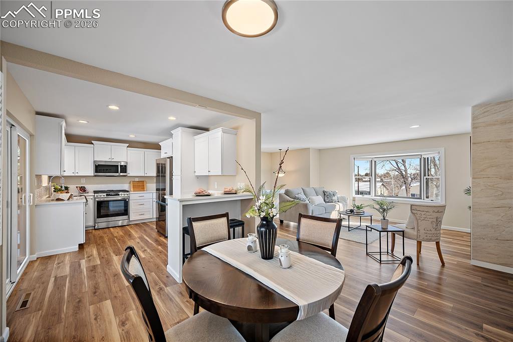 Image 8 of 45: Dining space open to the kitchen 